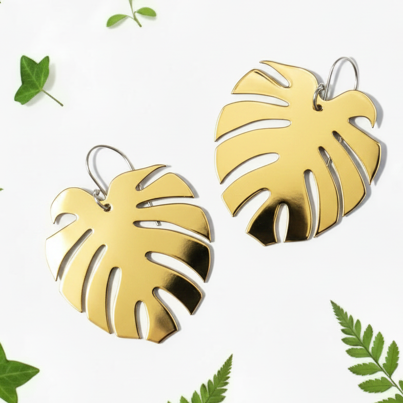 Monstera earrings in highly metallic gold