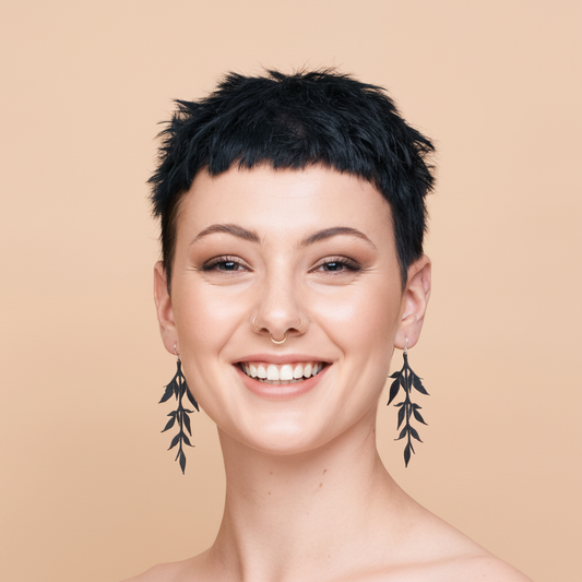 Happy model with leaf vine earrings